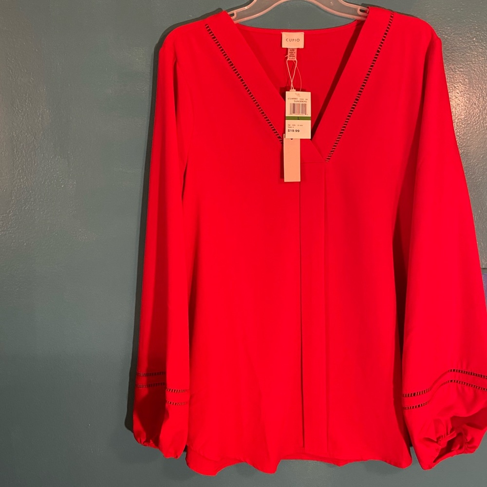 Tangerine blouse by Cupio. Never worn.